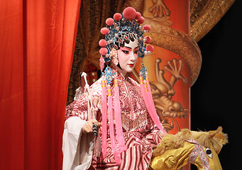 Image showing chinese opera dummy and red cloth as text space ,it is a toy,not