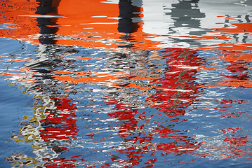 Image showing orange, gray and white reflection in the water