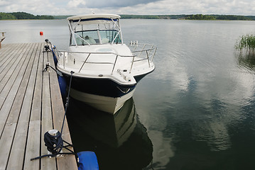 Image showing big white boat tied up at the seashore