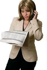 Image showing Businesswoman reading Financial news