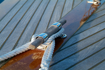 Image showing Cleat and rope on a wooden sailboat