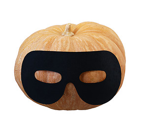 Image showing Small orange pumpkin in masquerade mask