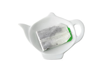 Image showing Teabag on teapot shaped saucer