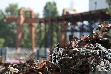 Image showing Pile of scrap iron and crane