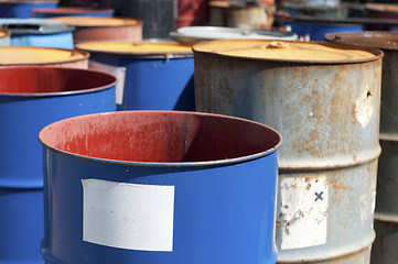 Image showing Old colored barrels for oil products