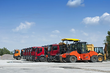 Image showing Trucks, rollers and machinery for asphalting