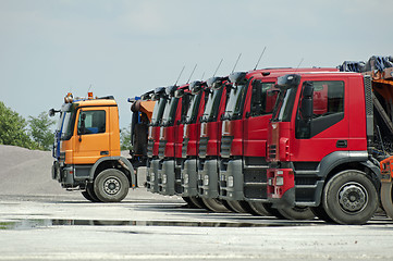 Image showing Trucks, rollers and machinery for asphalting