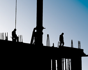 Image showing Construction site with crane and workers