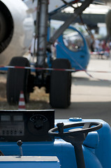 Image showing Airport service car and plane rubber on the background