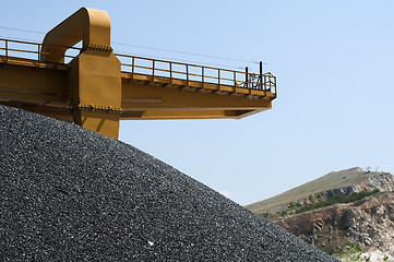 Image showing Asphalt pile and crane in quarry