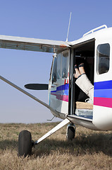 Image showing Female legs in a helicopter