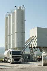 Image showing Cement factory and a truck loading cement