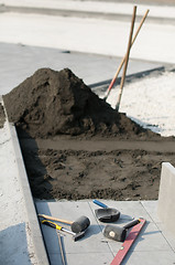 Image showing Tiling of pavement and sand pile