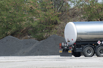 Image showing Piles of asphalt and track