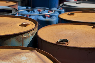 Image showing Old colored barrels for oil products