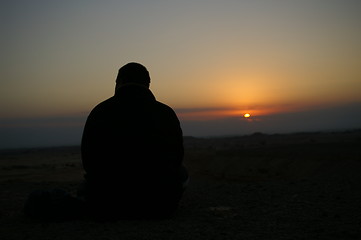 Image showing Looking to a sunset - meditation