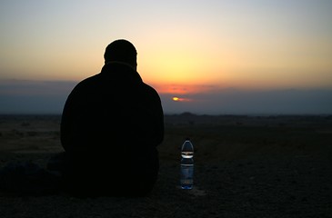 Image showing Looking to a sunset - meditation