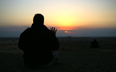 Image showing Looking to a sunset - meditation