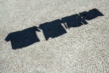 Image showing Shadow of clothes on a laundry line