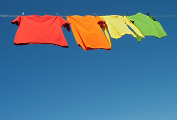 Image showing Bright clothes on a laundry line