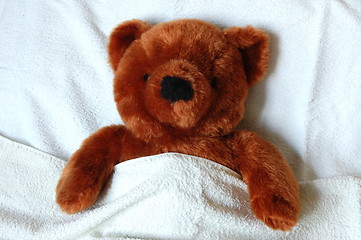 Image showing sick teddy with injury in bed