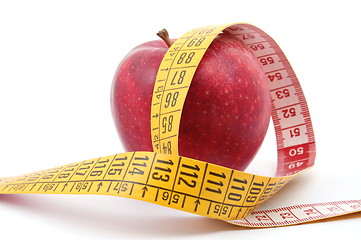 Image showing Apple and measuring tape on white