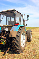 Image showing Tractor in a field, agricultural scene in summer