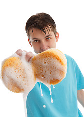 Image showing Child with soapy dripping sponge