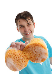 Image showing Boy using a soapy sponge to clean