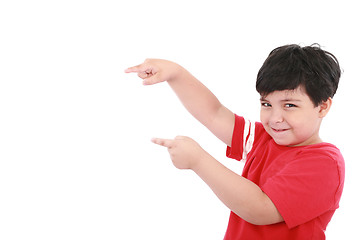 Image showing A little boy points at something, boy presents something 