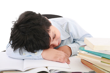 Image showing adorable boy tired to study a over white background 