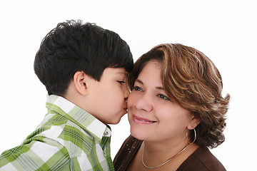 Image showing little boy kiss his mother on a white background 