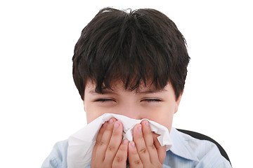 Image showing sick boy blowing his nose, white background  