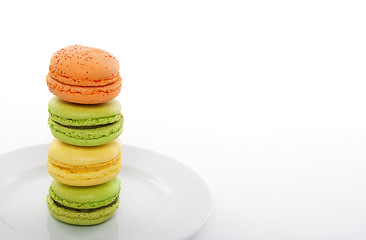 Image showing Colorful macarons on a white plate