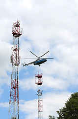 Image showing installation of cell tower by helicopter