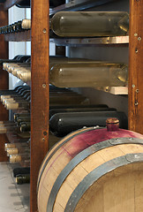 Image showing A little wine barrel and bottles wine