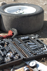 Image showing Car mechanic tools and tire