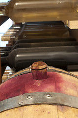 Image showing A little wine barrel and bottles wine