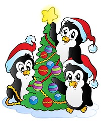 Image showing Three penguins with Christmas tree