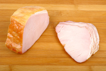 Image showing meat on a wooden cutting board