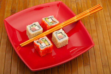 Image showing sushi on wooden background