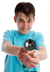 Image showing Cheeky boy pointing a garden hose