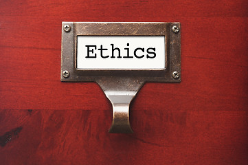 Image showing Lustrous Wooden Cabinet with Ethics File Label