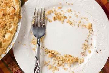Image showing Overhead of Pie, Fork and Copy Spaced Crumbs on Plate