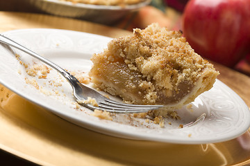 Image showing Half Eaten Apple Pie Slice with Crumb Topping