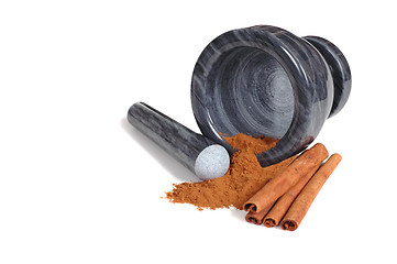 Image showing Mortar with pestle and cinnamon