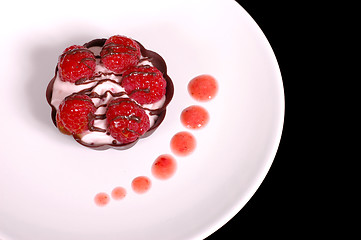 Image showing Rasberry mousse tart with strawberry sauce