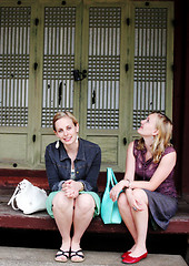 Image showing Two friends sitting on a step