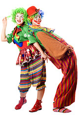 Image showing Two clowns are back to back