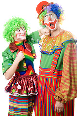 Image showing Female clown punching clown